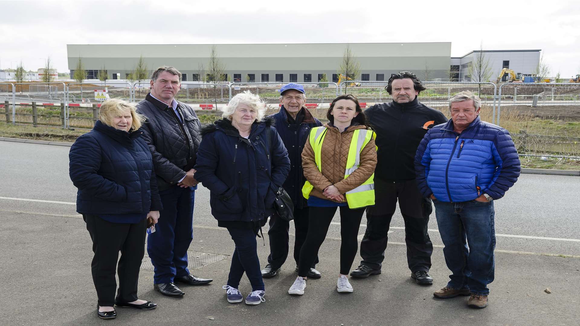 Queenborough Town Council members, from the left, Sue Simpson, Mike Whiting (representing Gordon Henderson), Jackie Constable, Ted Pye, Zoe Swarbrick, haulier Paul Wigglesworth and Swale councillor Richard Darby outside the new Aldi distribution centre at Neats Court, Queenborough.