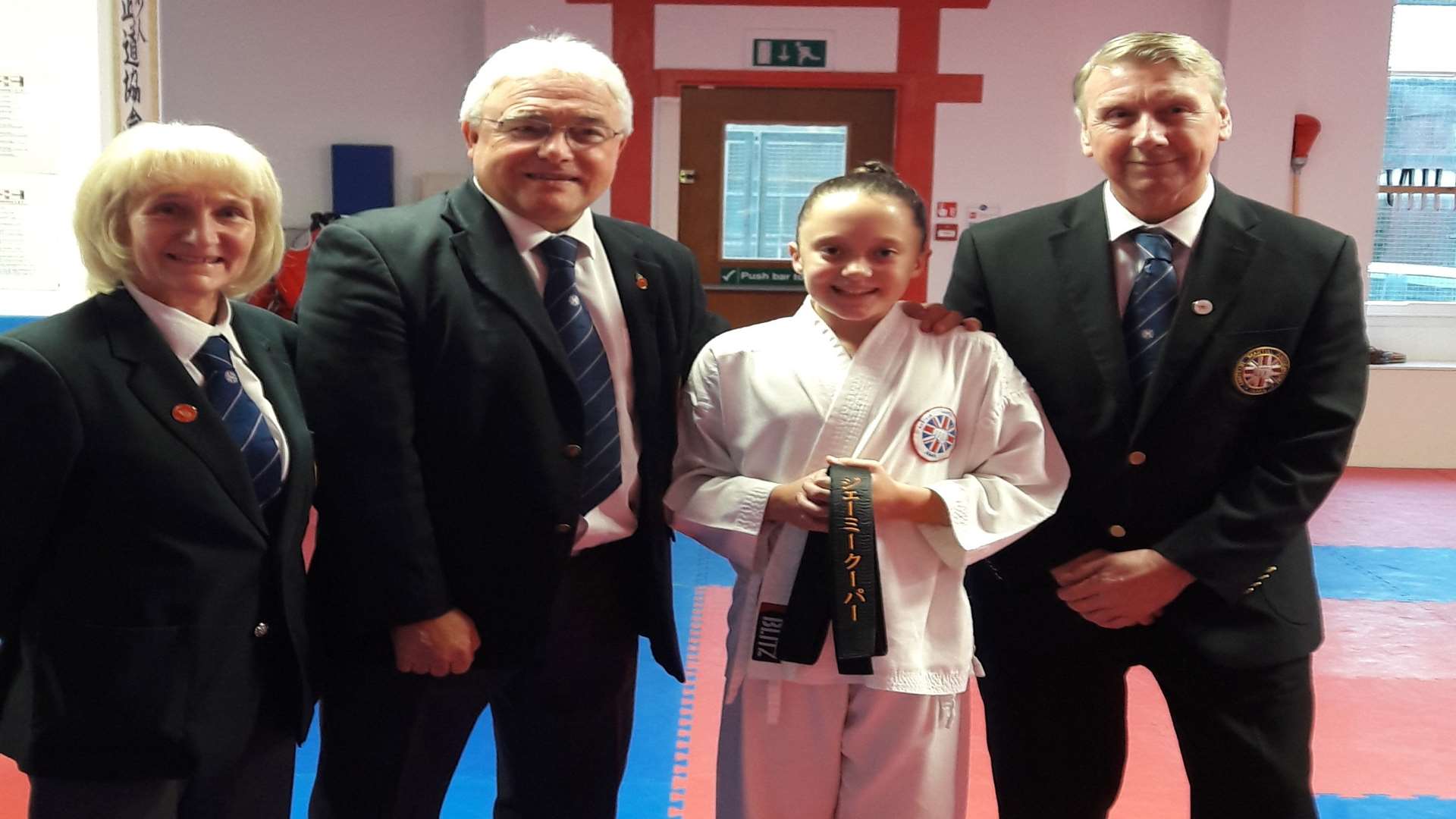 Jaime Cooper, 11, with WUKF European officials Peter Allen and Christine Pullan, and Jiu Jitsu and Martial Arts International director William Riley.