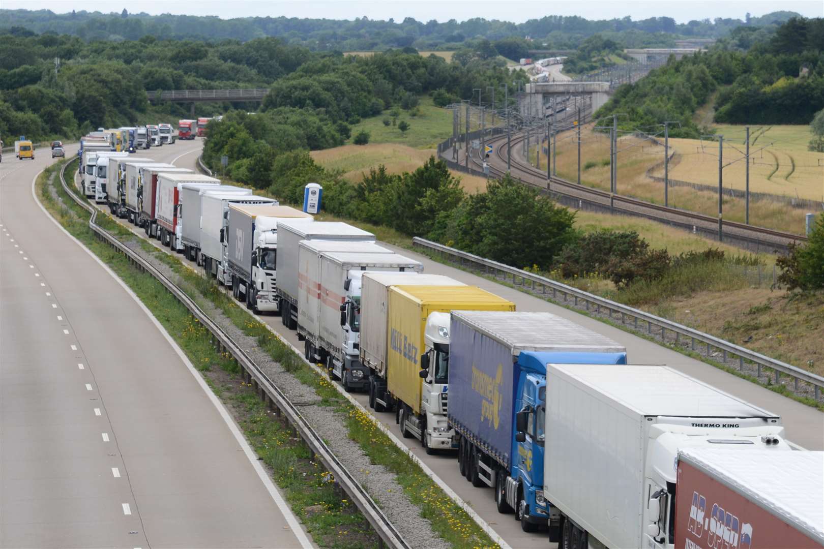 Lorries in a queue coast bound near Charing approaching junction 9 for Ashford