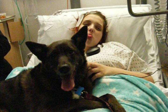 Becky with her beloved dog Misti on Christmas Day in hospital