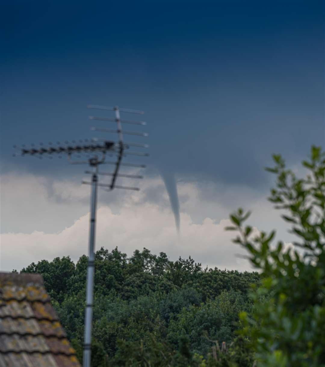 David English captured this funnel cloud forming in the Bredhurst area close to the M2 from his Rainham home this afternoon. Picture: David English