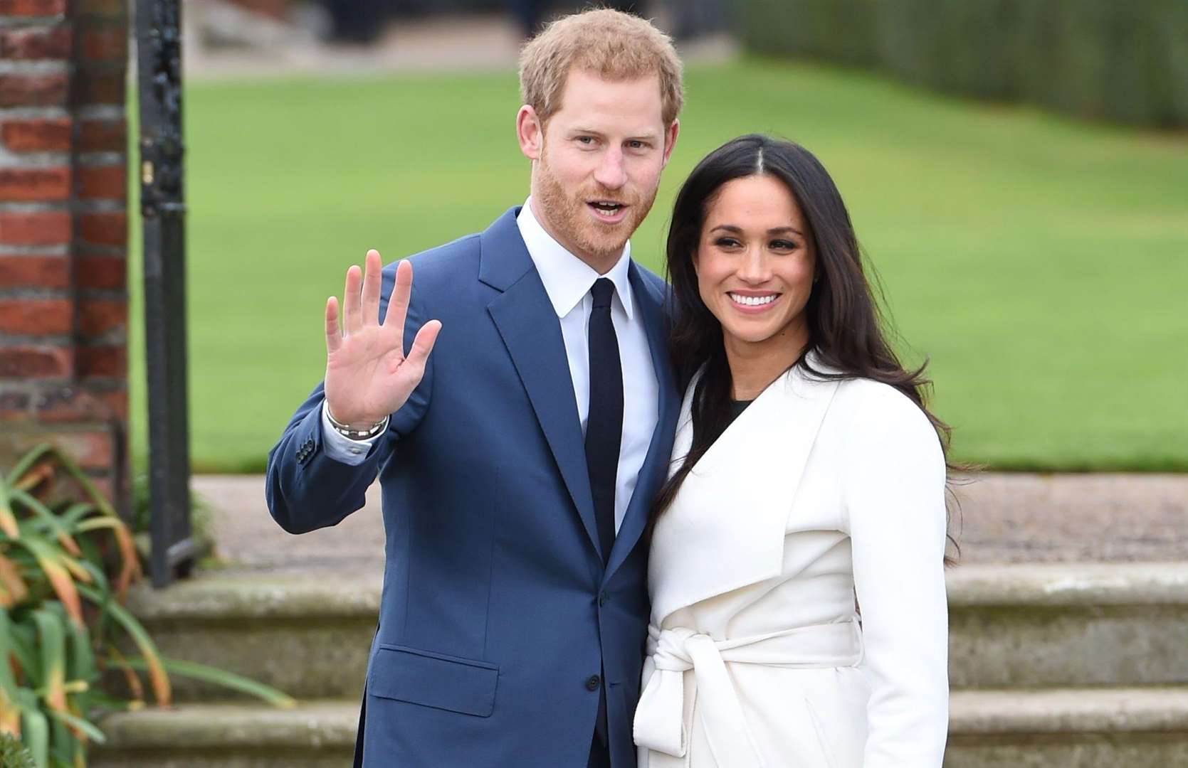 Prince Harry and Meghan Markle in the Sunken Garden at Kensington Palace, London, after the announcement of their engagement. Picture: Eddie Mulholland/Daily Telegraph/PA Wire