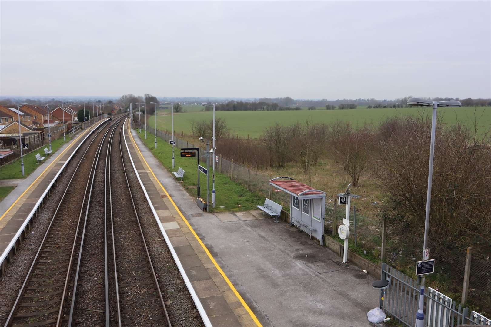 Railway lines at Kemsley Halt showing farmland to the right