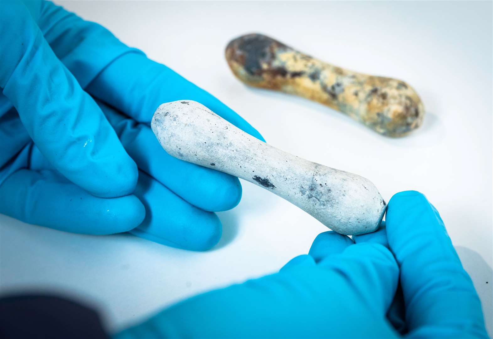 Ceramic wig curlers recovered from the wreck - which would have been used by the captain to keep his hair in tip-top condition. Picture: Christopher Ison/National Museum of the Royal Navy