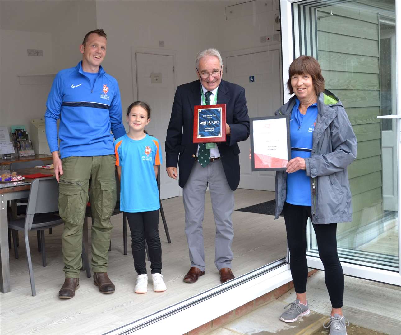Co-chairs Richard Dawson (left) and Georgina Noakes with junior member Milaya Dawson and John Ratcliffe who opened the clubhouse