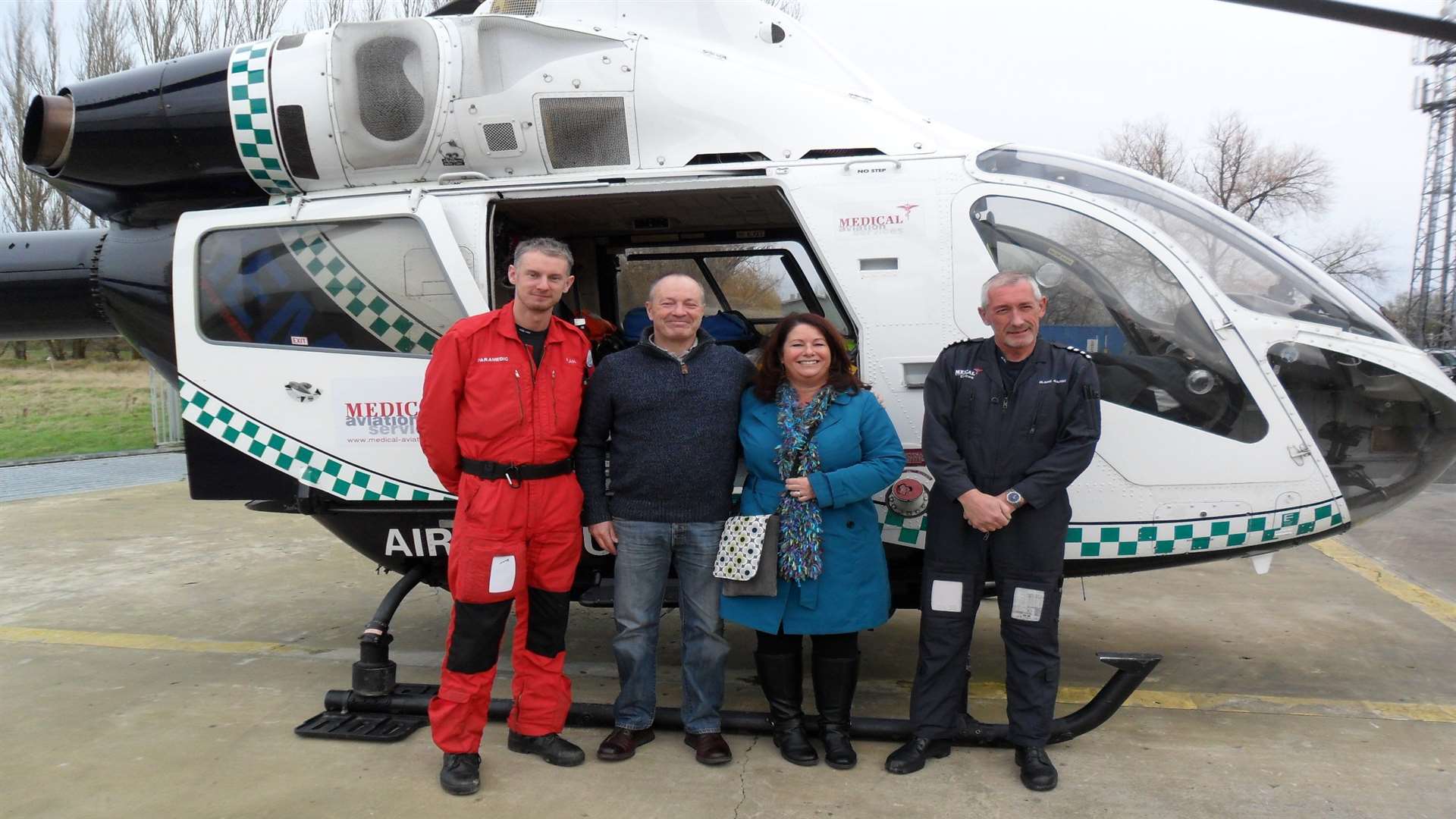 Air ambulance paramedic Alan Cowley, John and Alison Willoughby, and chief pilot, Captain Blaine Ashurst