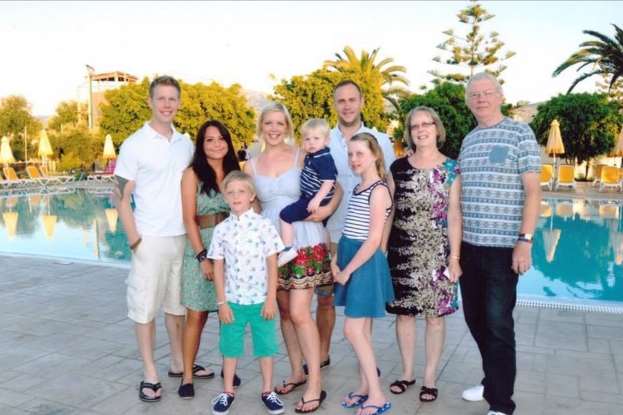Christopher Pollitt and girlfriend Meagan with his whole family in happier times
