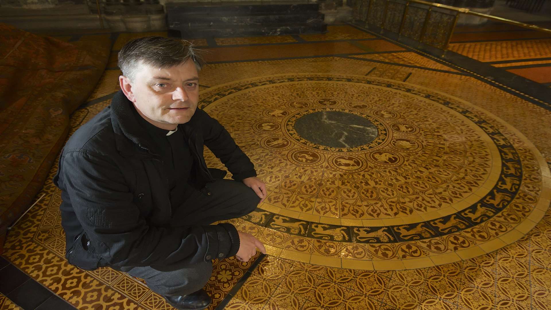 Philip Hesketh with the Zodiac tiling near the high alter in Rochester Cathedral