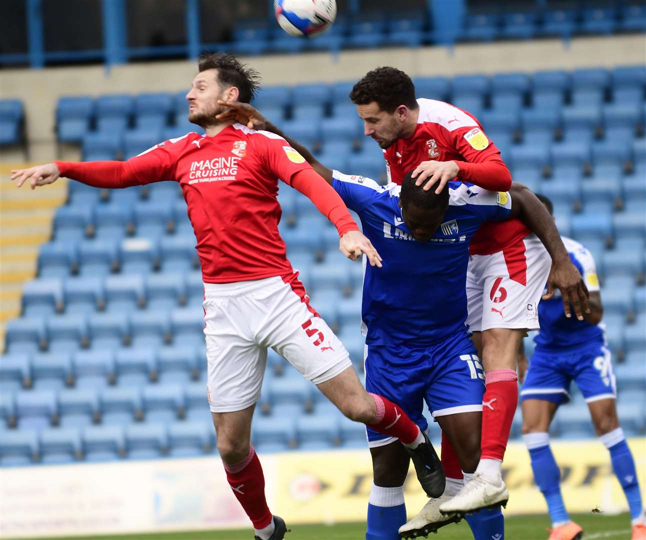 Gills striker John Akinde battles in the air. Picture: Barry Goodwin (43420945)