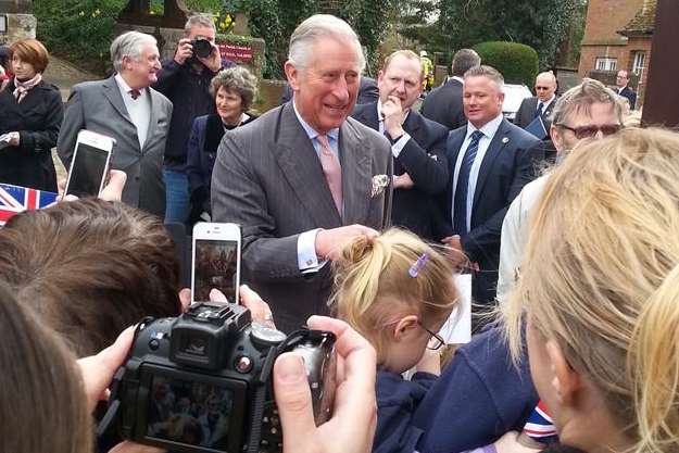 Prince Charles meets the crowds lining the streets of Yalding today