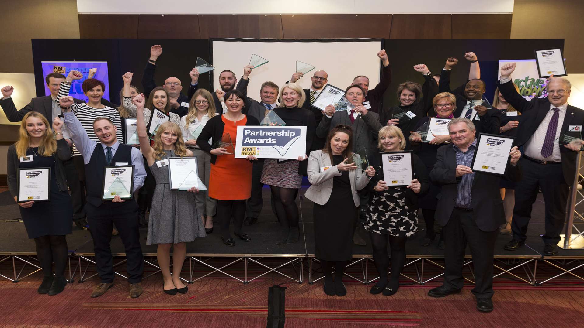 Recipients of 10-year and five-year partnership awards at the third annual KM Charity Partnership Awards 2018.