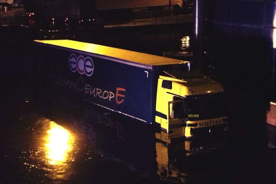 Abandoned lorry in flood water at Dover Western Docks. Picture @StaceyyyKent