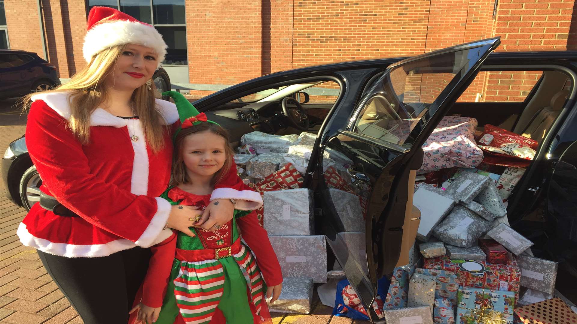 Melisa Robinson and Lilly Osborne with the presents they dropped off at KCC’s Kings Hill offices.