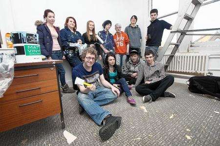 Members of the Restoration Youth group renovate the office so it can be used by them