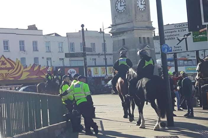 Mounted police by Margate's clocktower prepare for the march