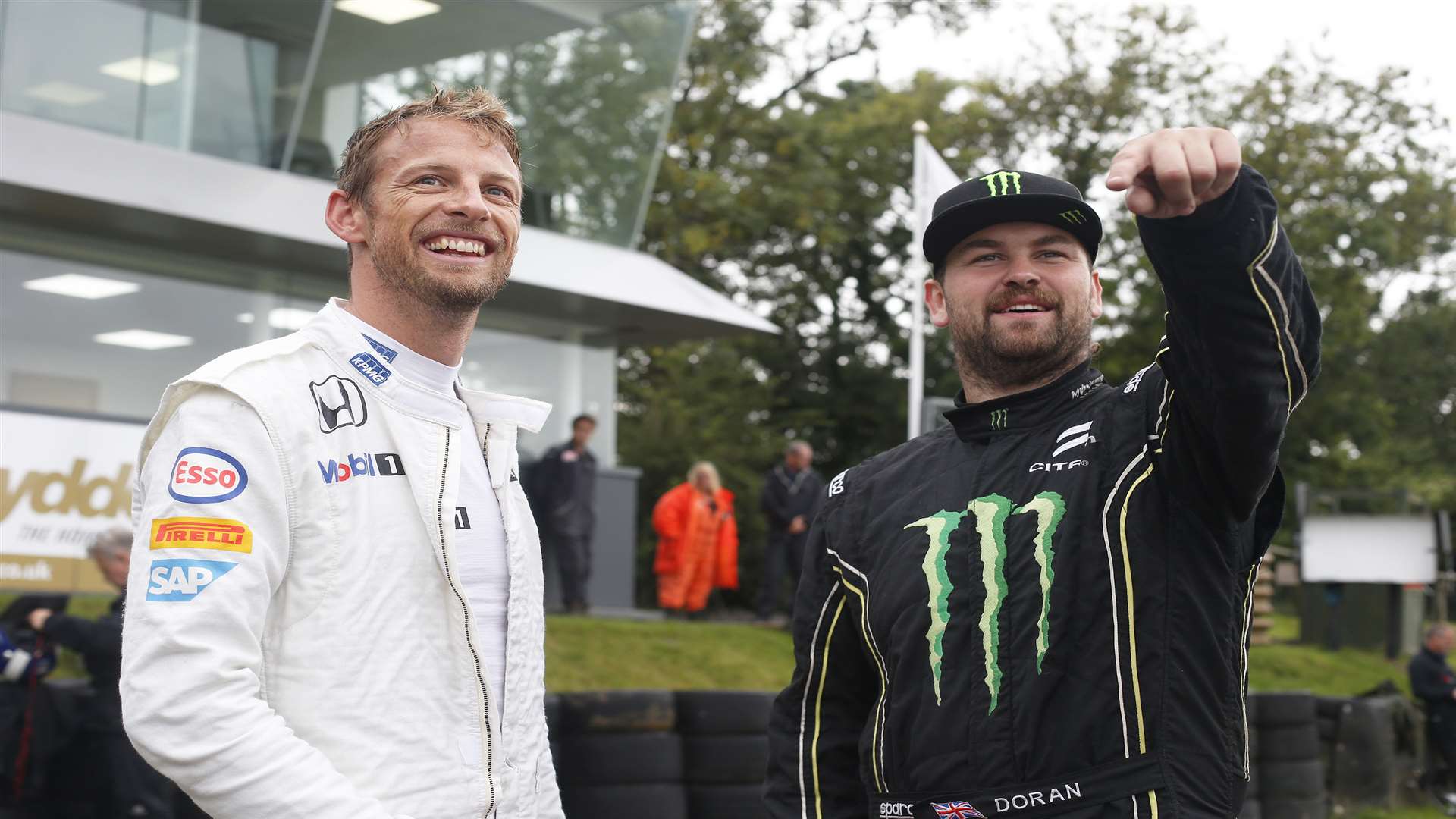 Jenson Button chats with current rallycross star Liam Doran during filming