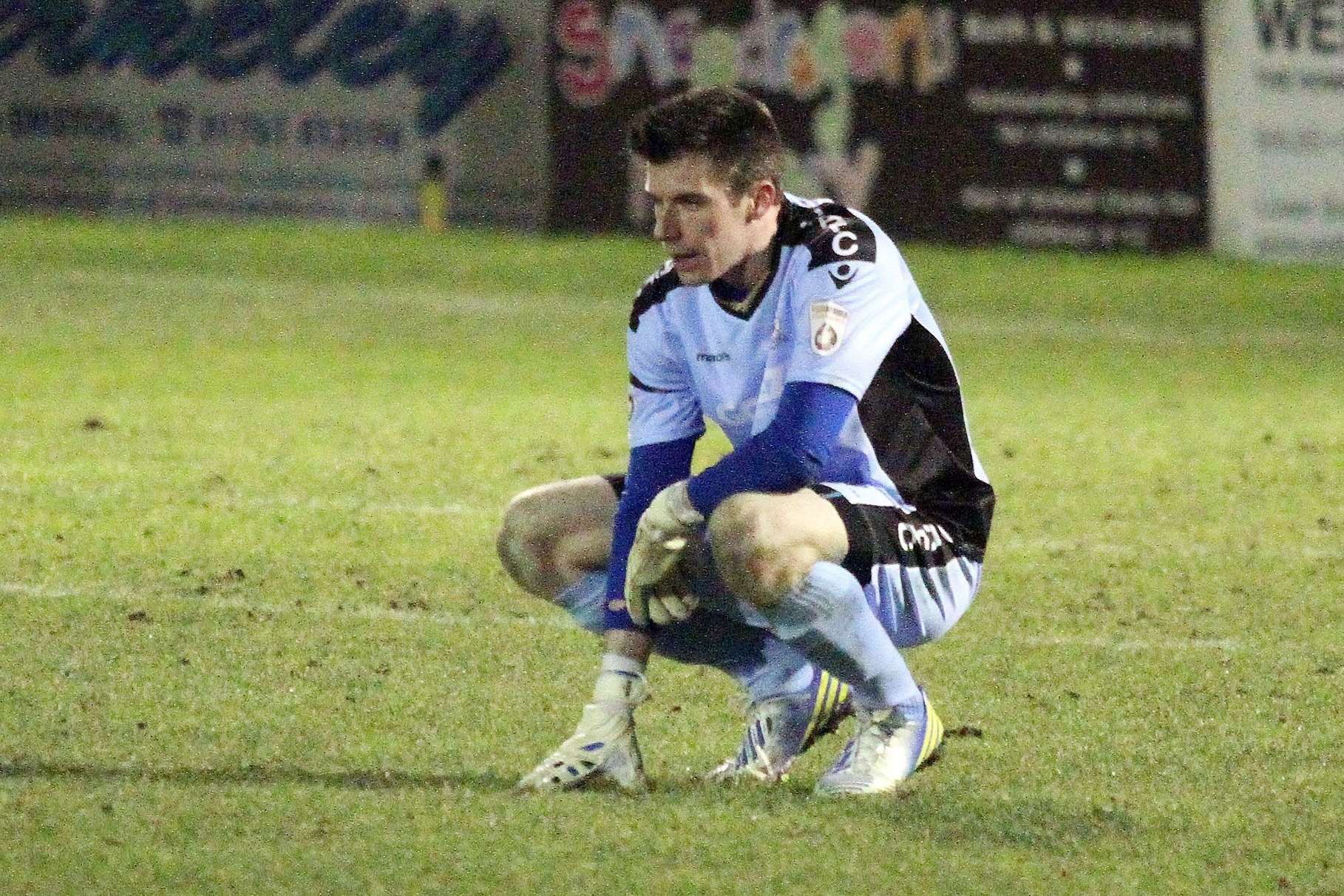 A dejected Mitch Walker after Dover's defeat to Bath City in the 2014/15 cup. Picture: Simon Howe