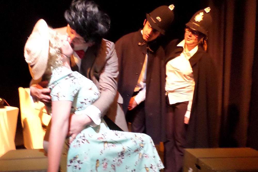 Mr Hannay (Richard Jeferies) throws himself on the unsuspecting Pamela (Denise Wilson) in a desperate attempt to hide from the police.