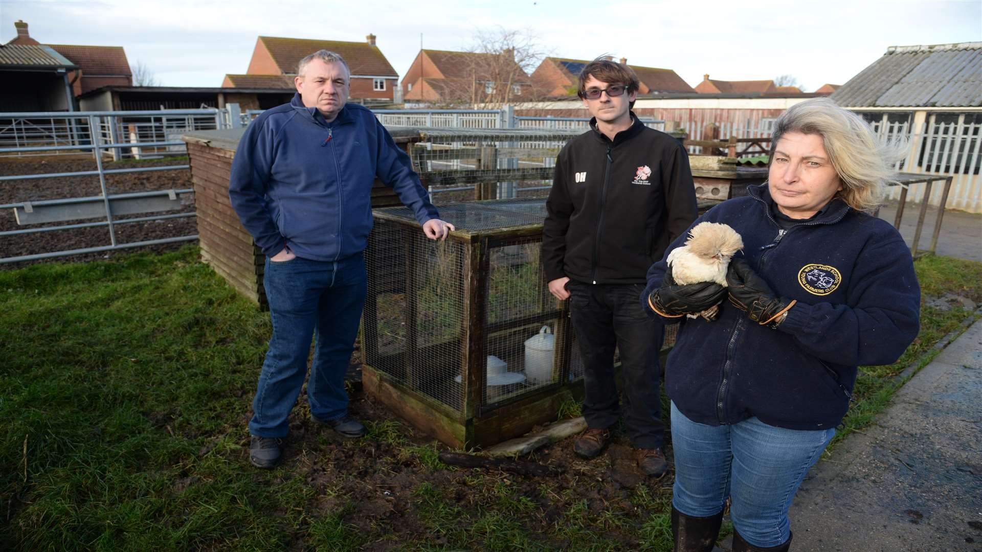Head Simon Cox with Farm Manager Oliver Howland and Farm Technician Sue Hodkinson with one of the remaining chickens at the Westlands School Farm