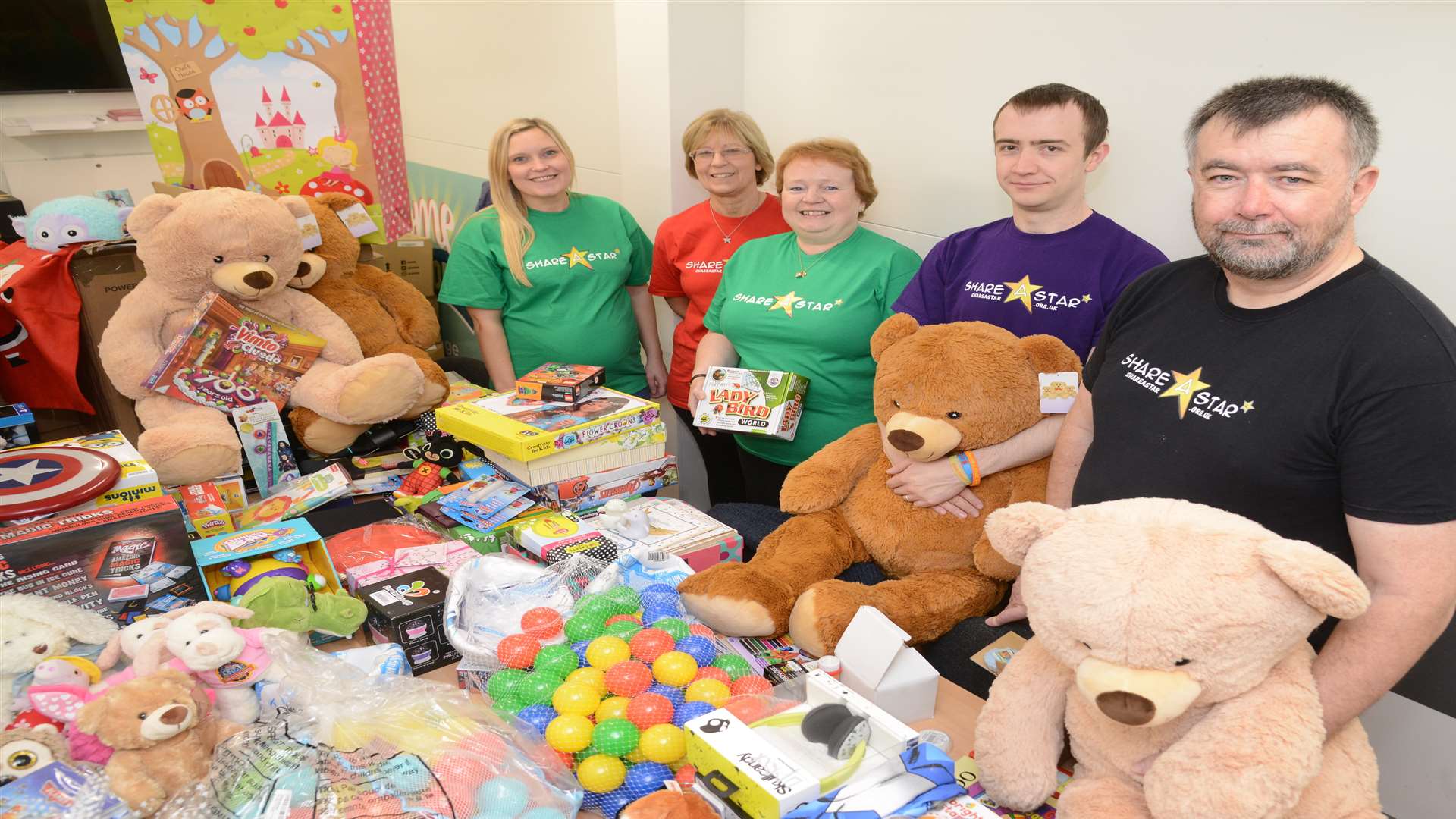 From left, Vicki Hughes, Sandi James, Kate Taylor, Samuel Bearman and Colin Taylor, packing presents for the Share a Star Christmas campaign. Picture: Gary Browne