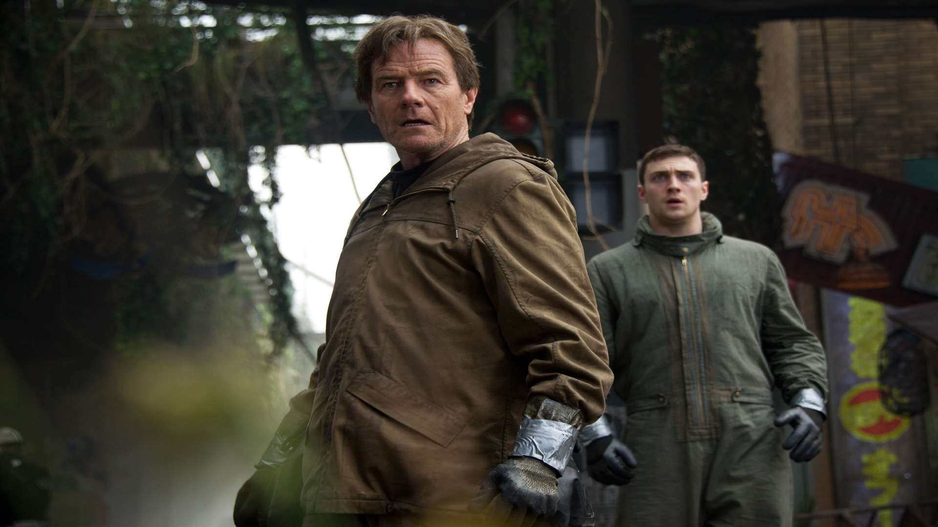 Godzilla, with Bryan Cranston as Joe Brody and Aaron Taylor-Johnson as Ford Brody. Picture: PA Photo/Warner Brothers