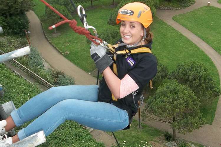 Rachel Hart of Folkestone abseiled for Ashford charity Includes Us Two. Rachel works at Holiday Extras, sponsor of the KM abseil challenge