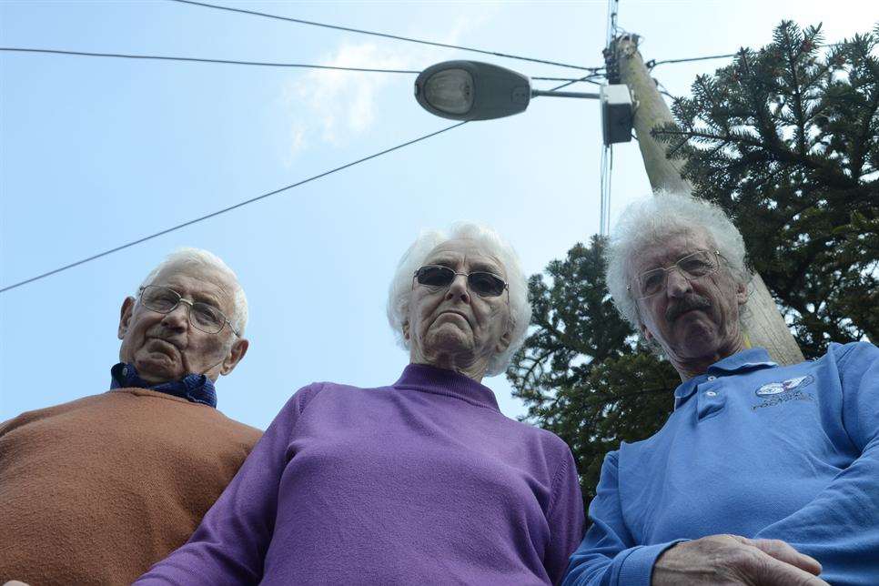 Harry Aldridge, Pauline Hebel and Neighbourhood Watch coordinator John Tress are worried about plans to turn off street lights