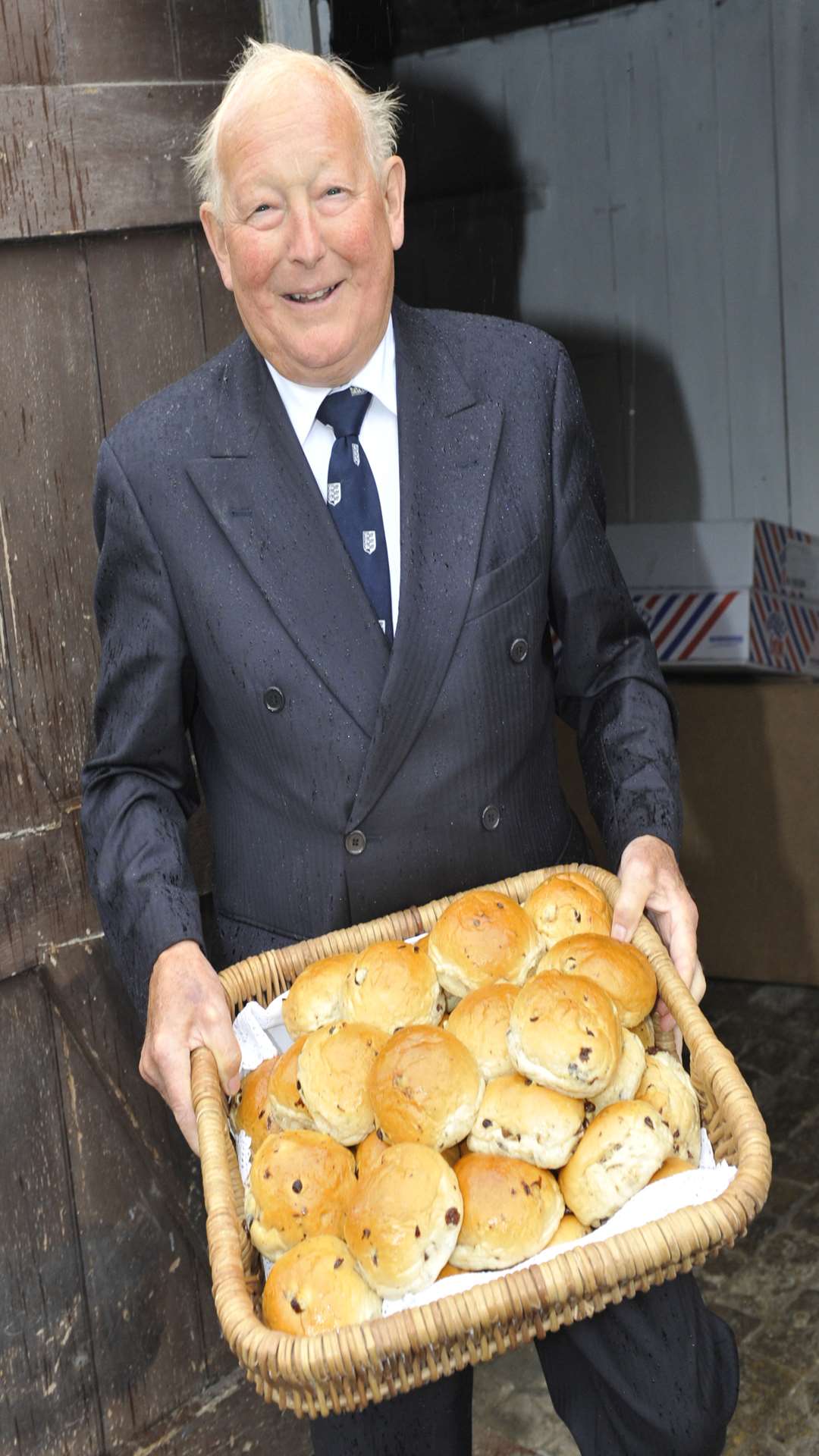 Cllr Joe Trussler in good spirits despite torrential rain at Sandwich's annual bun run