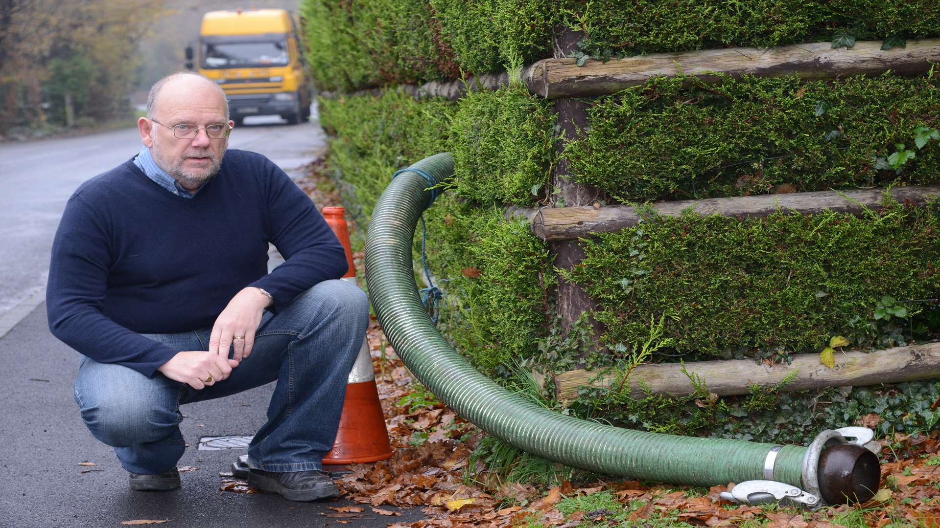 Brendan Morrissey pictured with a pipe connected to one of the pods in a residents' garden. Picture: Gary Browne