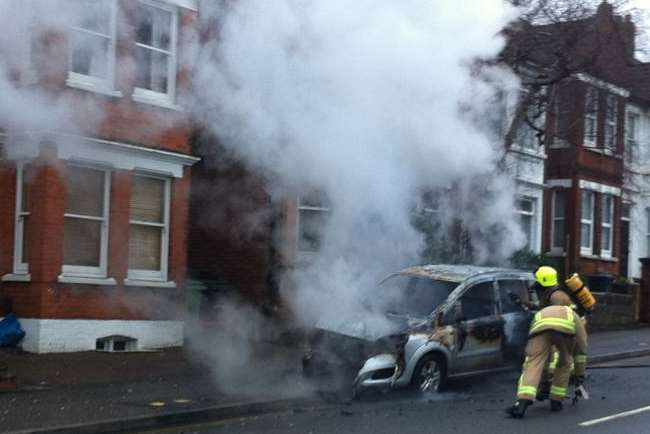 Smoke billows from the blazing vehicle. Picture: Brett Lewis