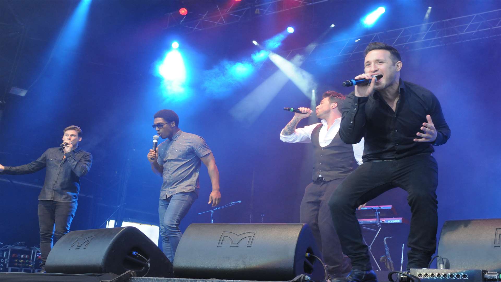 Antony Costa on stage with Blue