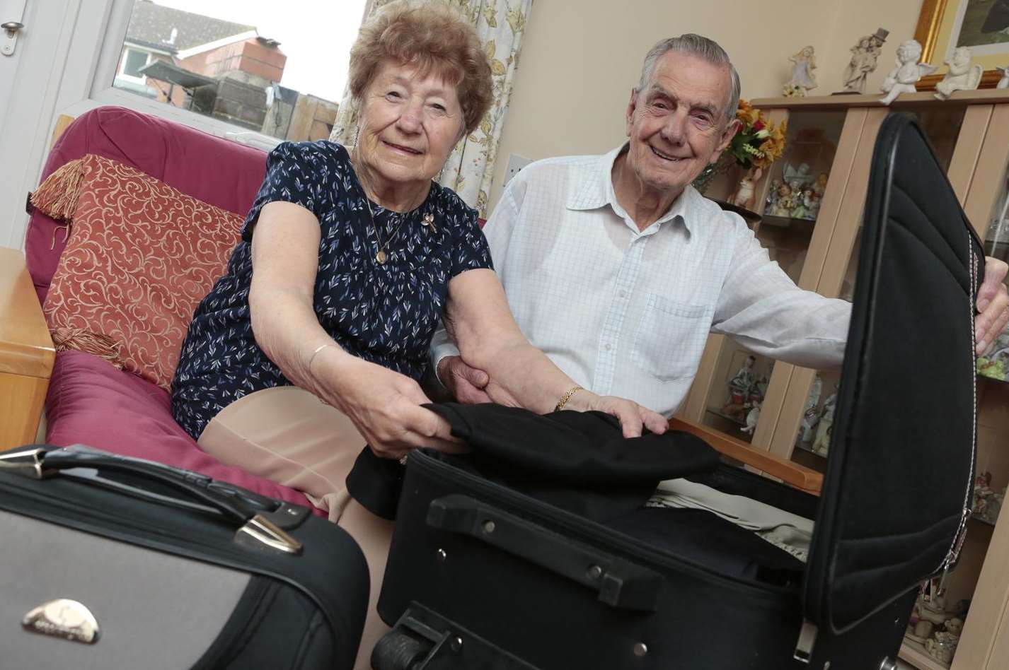 Madge and Charlie Pallett, both in their 90s, packing for their first holiday flight abroad together