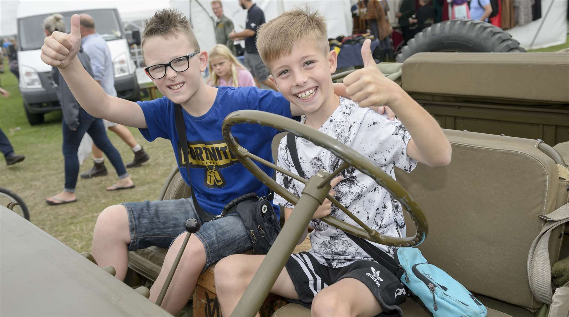 Ben and Callum ride in a 1943 Willys Jeep at last year's show Picture: Andy Payton