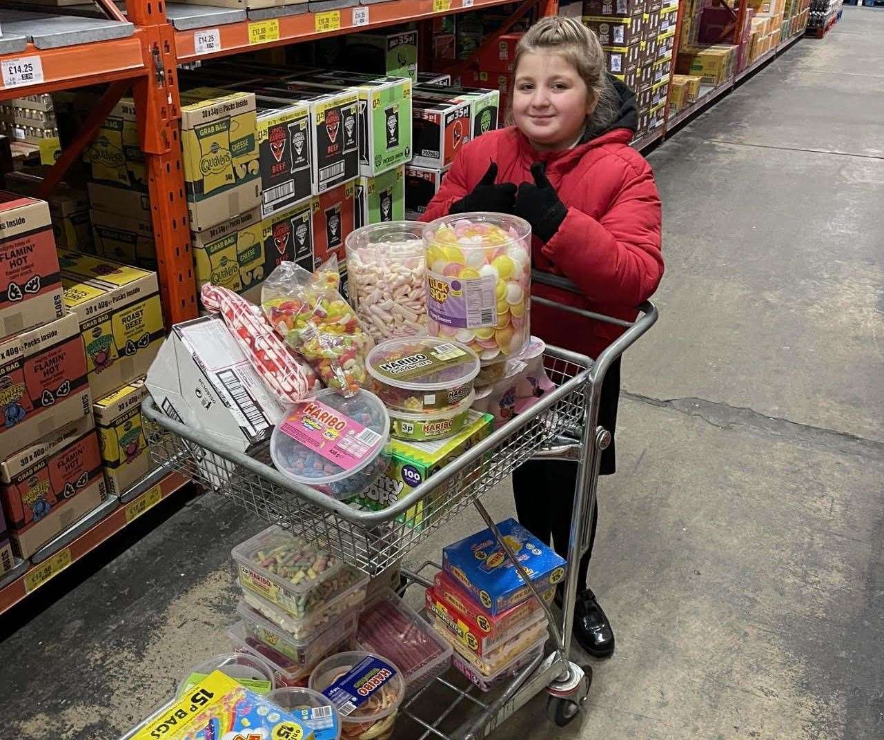 Ellie Mae Middleton buying supplies for her sweet shop at Buckley's indoor market in Sittingbourne