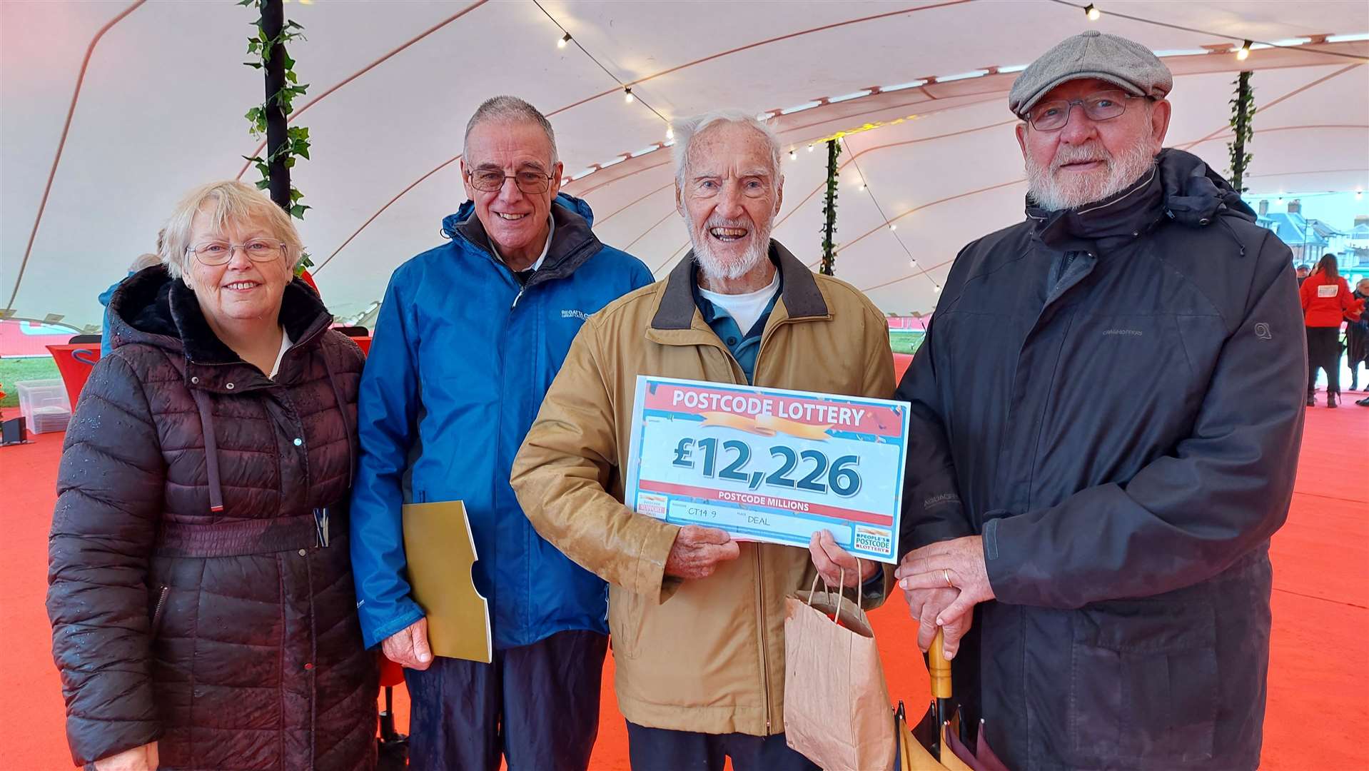 Ninety-three-year-old Fraser Greenwell collected his huge prize with friends Anne Matthews, Barry Matthews and John March
