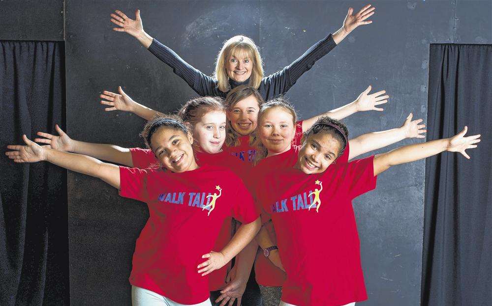 Ann Duke with youngsters at Walk Tall. Picture: Ashley Carter