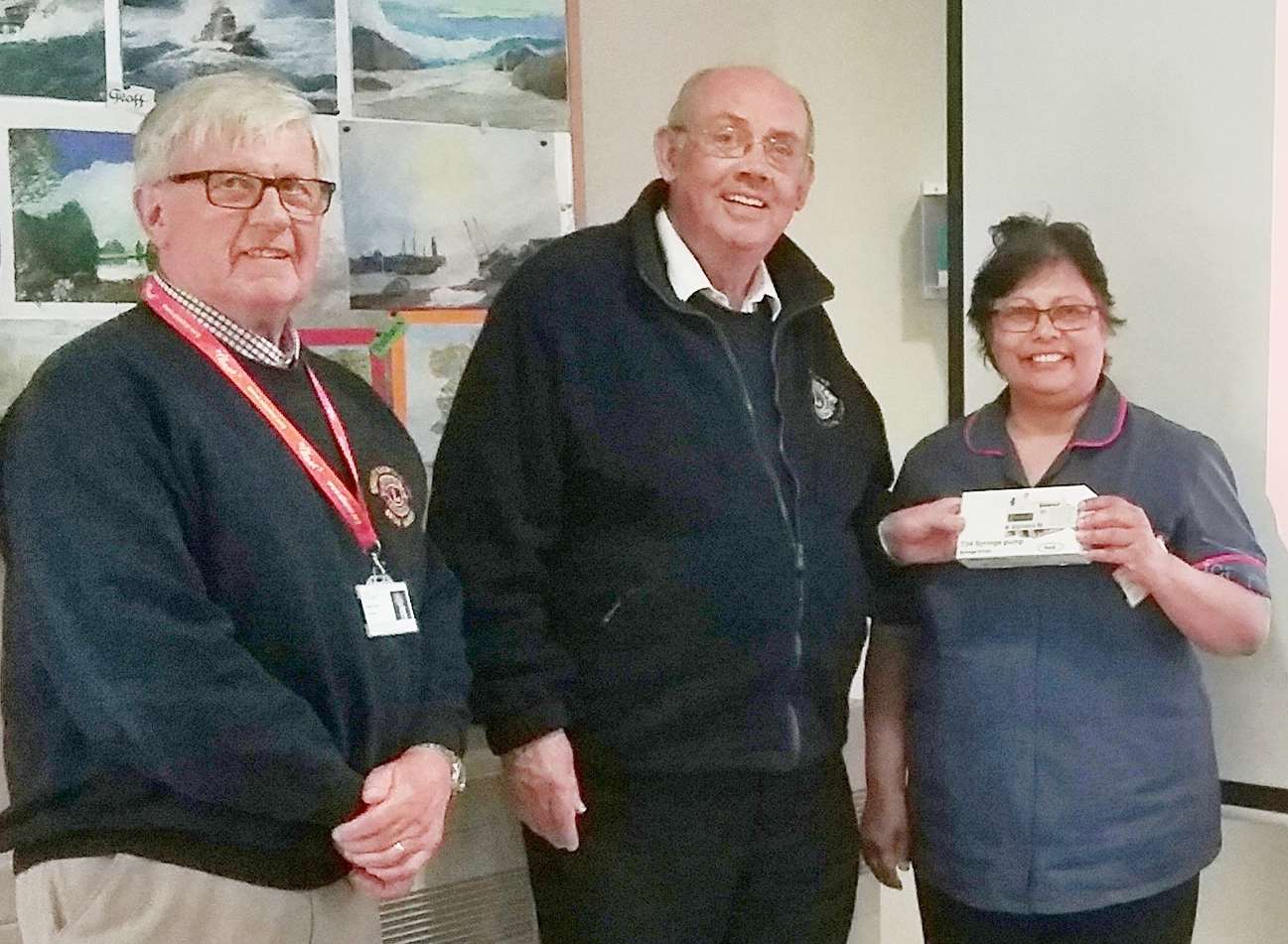 The Swanley and North Downs Lions Club welfare chairman Steve Gray (centre) with fundraising chairman Bryan Harris and ellenor inpatient ward manager Angela Cooke