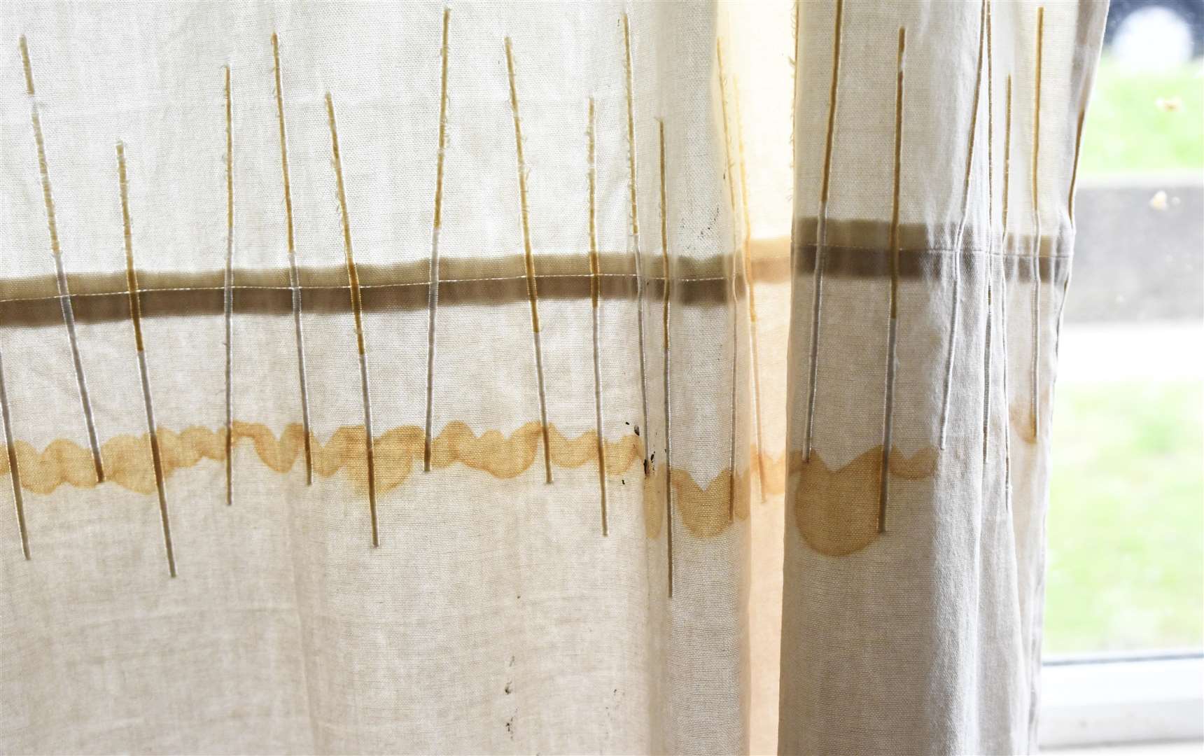 The stain on the curtain shows how high the levels had risen inside one of the flats affected