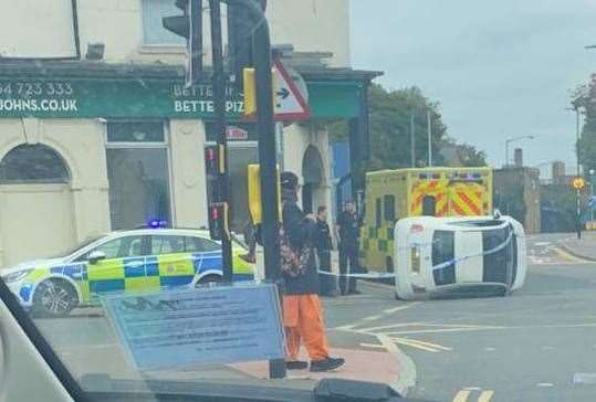 A car overturned after crashing into a metal bollard in London Road, Strood, near Papa John's Pizza takeaway last weekend. Picture: Liv Hopkins