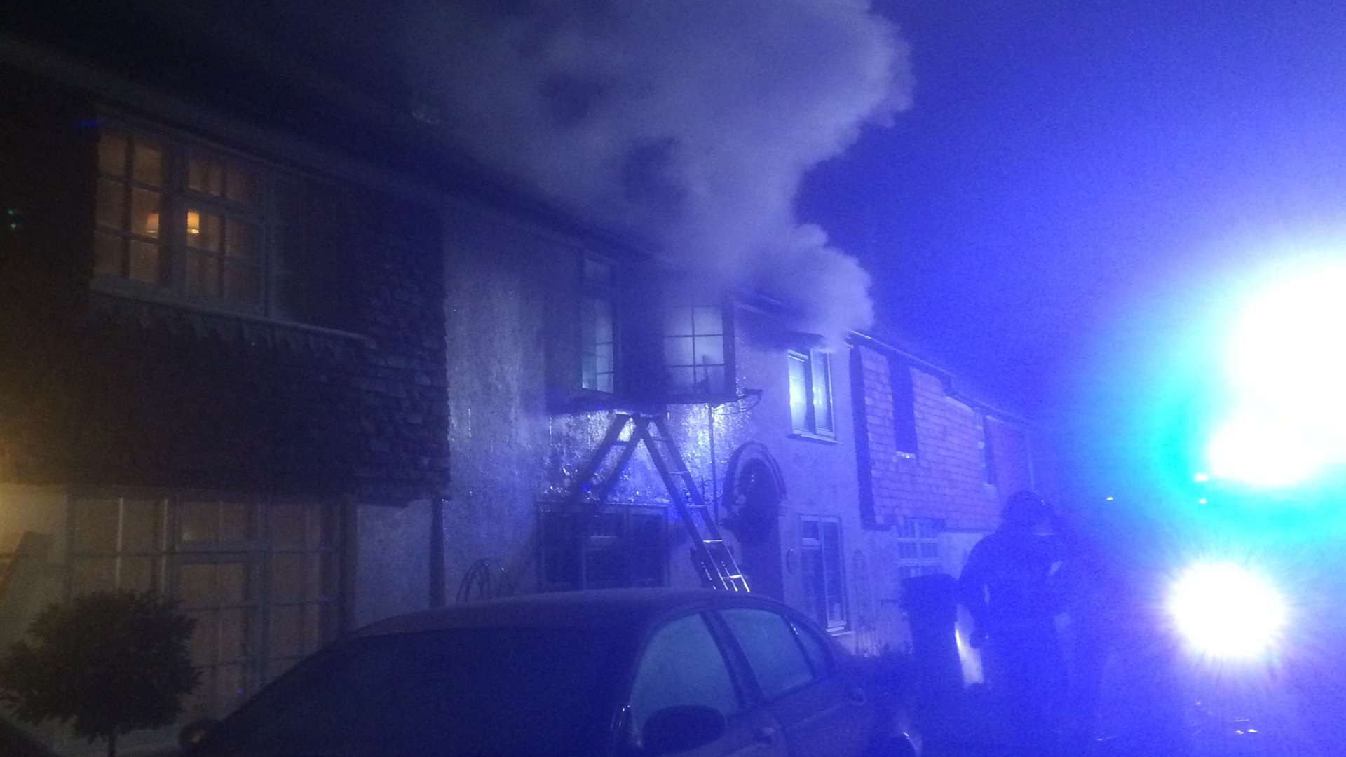 Smoke billowing from the house in the early hours. Picture: Alan MacDonald