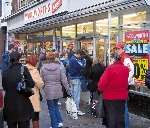 Bargain hunters queue outside the Sheerness store this morning