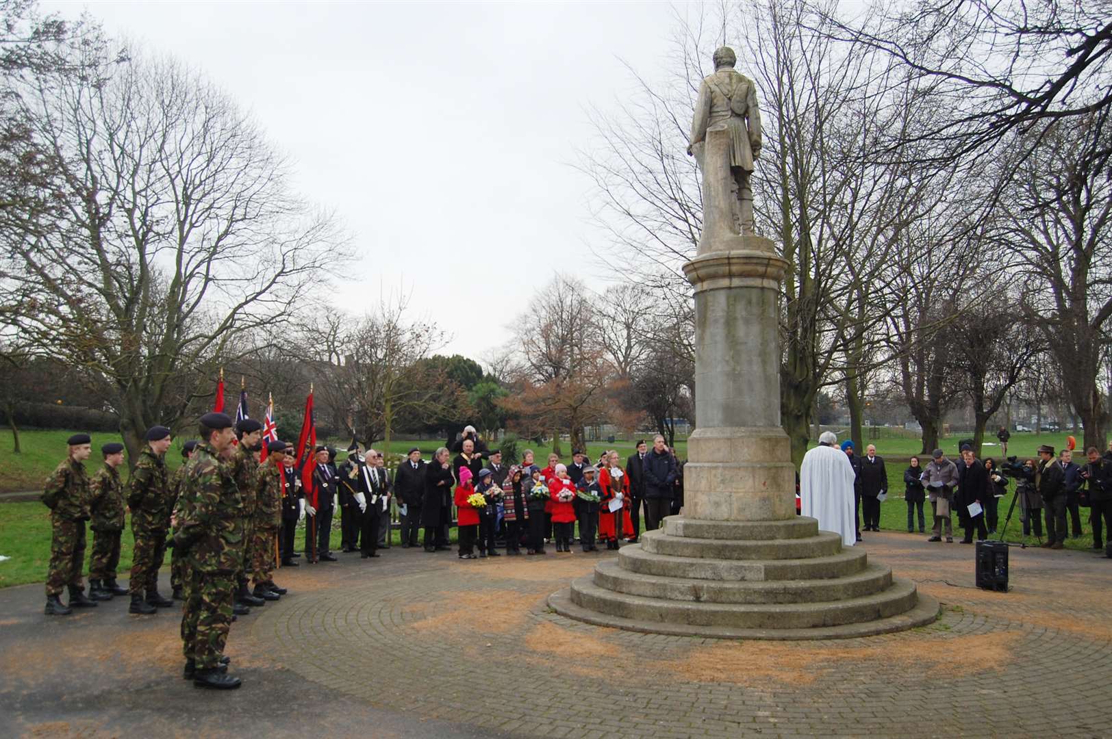 People gather at a service to commemorate the death of General Charles Gordon at the statue erected in his honour in the Fort Gardens, Gravesend
