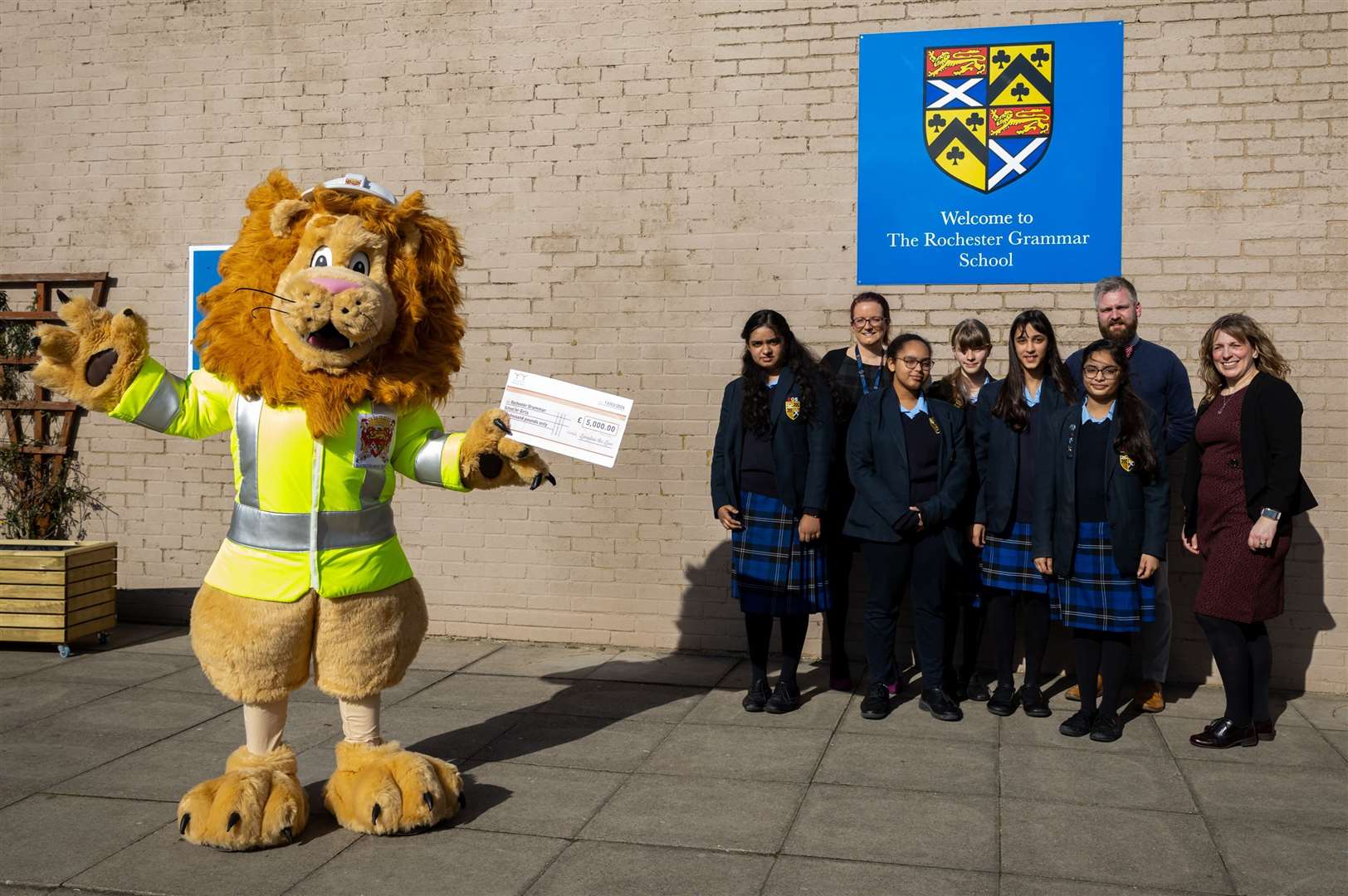 Langdon the Lion presented the cheque Rochester Grammar’s STEM club
