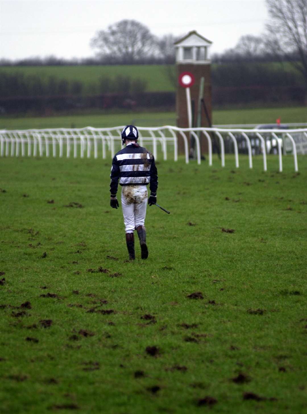 Ten years before the track closed, Jacques Ricou trudges back to the paddock after falling at the final jump in January 2002. Farewell, Folkestone...