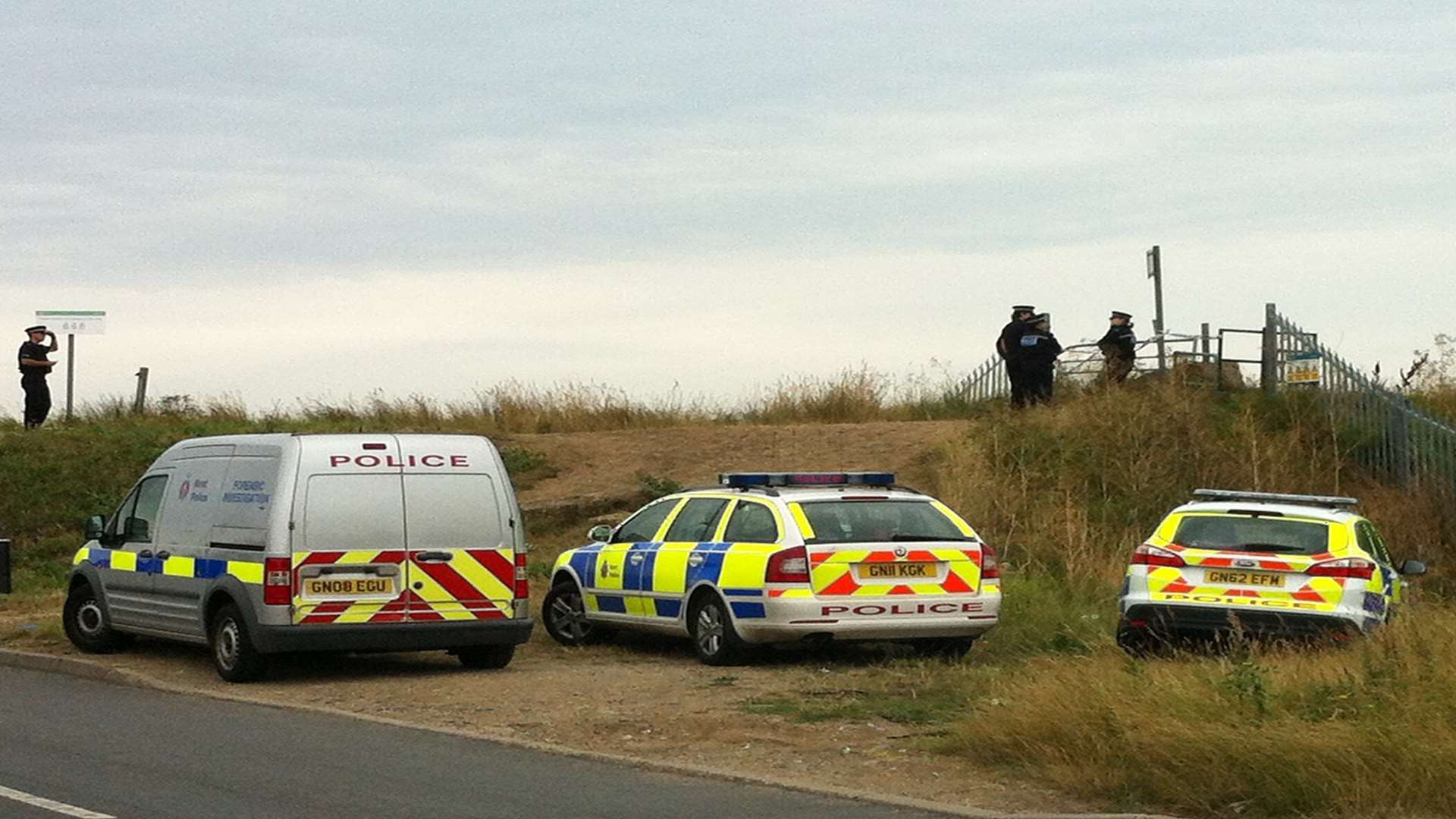 Police at the scene of the murder on Warden Bay beach