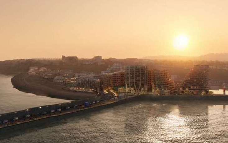 Image showing the proposed Folkestone seafront development – stretching from the already-built Shoreline Crescent flats on the left, to the tower blocks on the harbour arm car park on the right