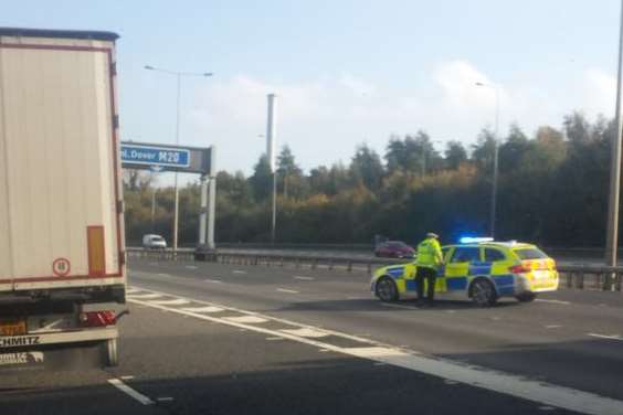A police car at the crash site on the M20 Credit: @ReeveSTARRR