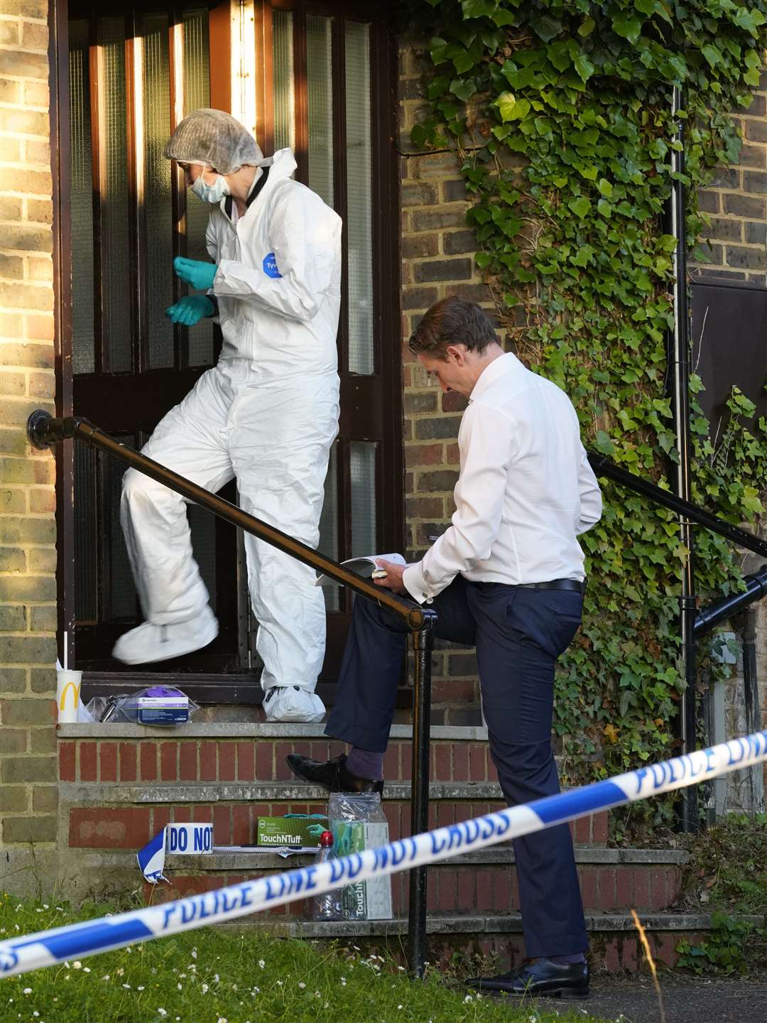 Forensic officers joined detectives at the scene yesterday afternoon. Picture: Andy Clark