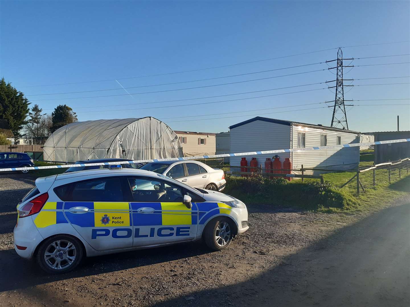 Police at the scene in Homefield Farm Road, Sutton-at-Hone, near Dartford