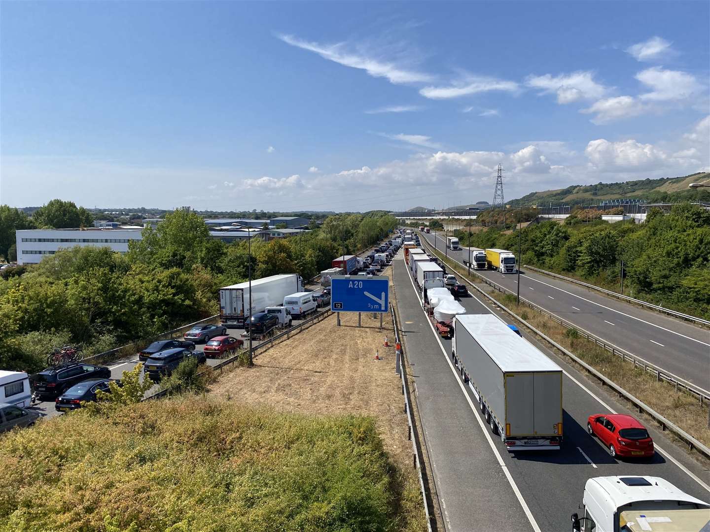 Traffic queues at the Eurotunnel terminal on the Londonbound carriageway of the M20 at Folkestone as the summer holiday traffic woes turn Kent's motorways into car parks